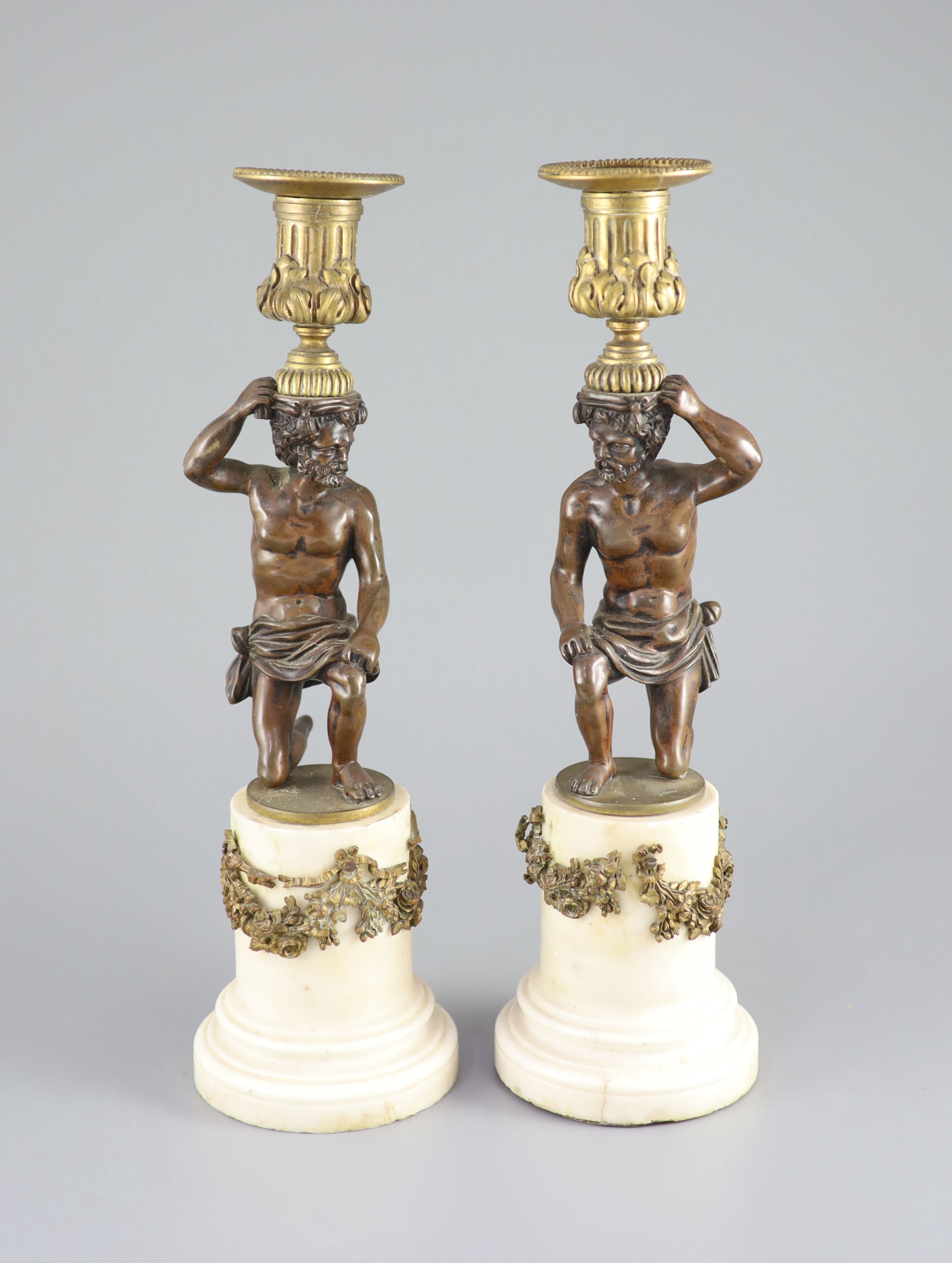 A pair of 19th century bronze and ormolu figural candlesticks, 33cm high.